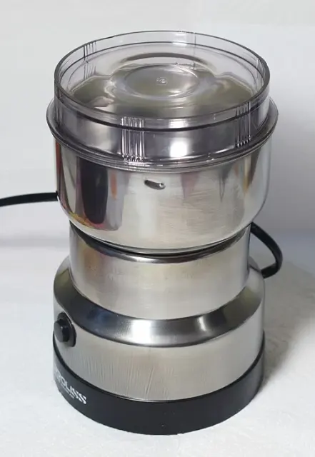 Kompakt elektrisk kaffekvarn med genomskinligt lock.